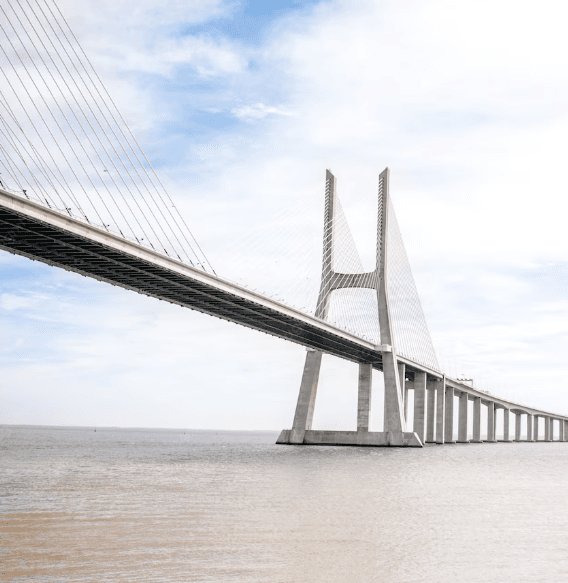 A long cable-stayed bridge reaching toward the horizon